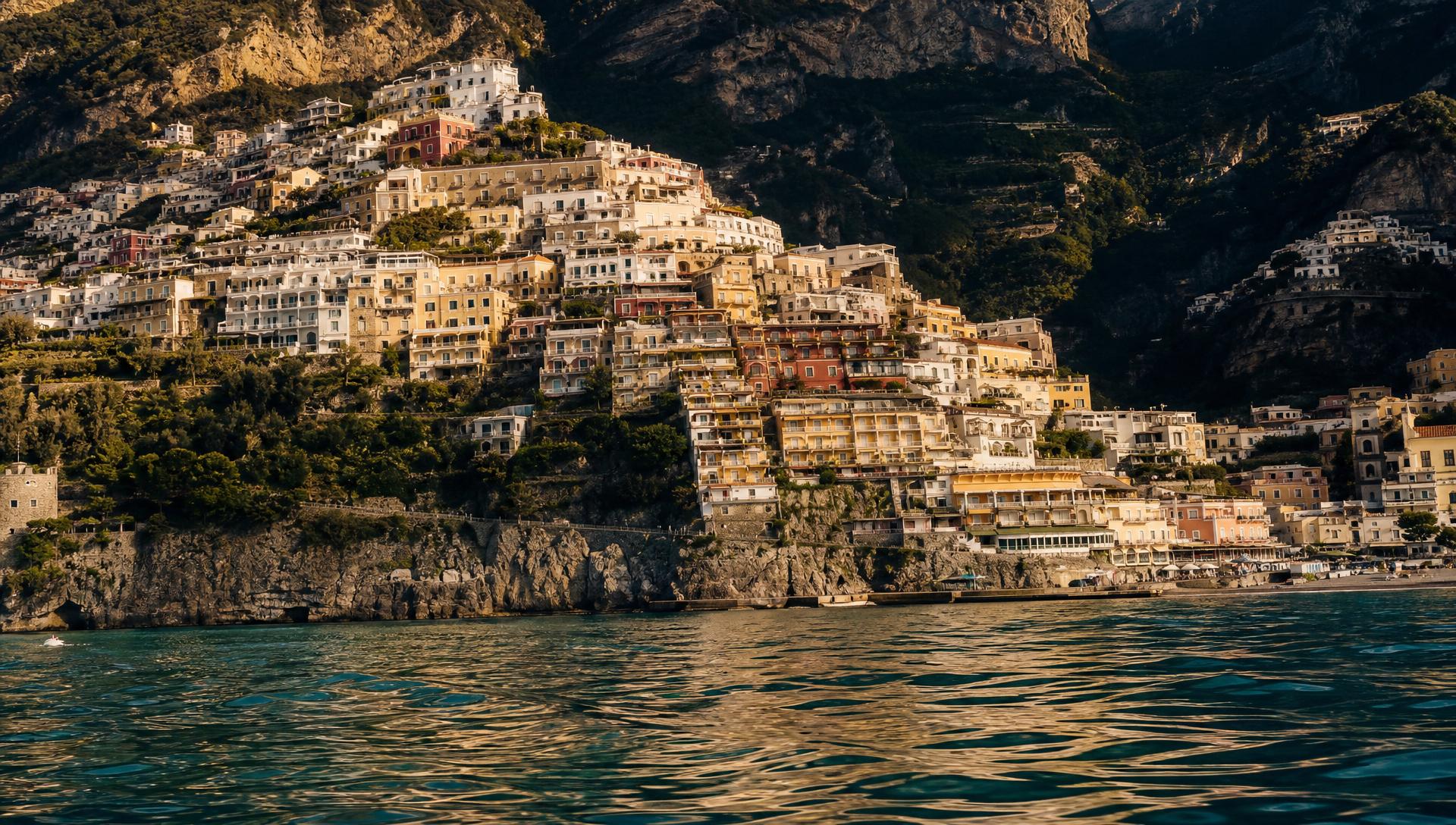 Positano colorful houses cascading down cliffs to turquoise sea